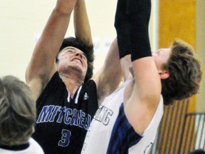 Connor Gettler (3) of the Mitchell DHS senior boys basketball team battles for a rebound against Listowel's Seth Johnston during action from the 10th annual Mitchell Bowl senior boys early bird tournament last Friday, Nov. 24 in Mitchell. The home team led by one, 22-21 at the half, and pulled away to a 56-32 victory in the 10-team tournament. ANDY BADER/MITCHELL ADVOCATE