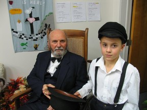 Jack Evans/For The Intelligencer
Grinch-like character George F. Potter, moves on and off stage in a wheel chair pushed by an assistant. Here, backstage, he gets his hat handed to him by Brady Sine, who plays George Bailey when he was a young drug store assistant.