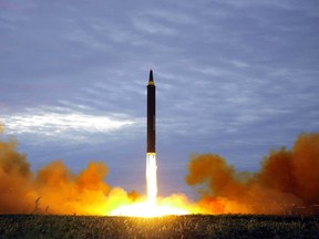 in this Aug. 29, 2017 file photo distributed on Aug. 30, 2017, by the North Korean government shows what was said to be the test launch of a Hwasong-12 intermediate range missile in Pyongyang, North Korea. Leaders of the Association of Southeast Asian Nations will mark the 10-nation bloc's 50th anniversary for two days of summitry under security in Manila starting Monday to tackle a slew of security worries including recent militant siege in the Philippines, displaced Rohingya and the escalating North Korea threat. The content of this image is as provided and cannot be independently verified. (Korean Central News Agency/Korea News Service via AP, File)