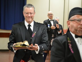 Ivan Bryce parades the haggis accompanied by Terry Mills during the St. Andrew's Society event at the Petrolia branch of the Royal Canadian Legion (File photo)
