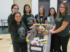 The Irish Miracle, an annual food drive by students and volunteers at Sarnia's St. Patrick's Catholic High School, is set for Saturday morning. Members of the organizing committee, from left, Lara Jose, Jessica Laucke, Michelle Rianto, Rachel Suglio, Bianca Iacobelli and Samantha Bedard, took part in a pep rally for the event Tuesday in the gym at the school. Students will be gathering food donations for the St. Vincent de Paul Society from homes in Sarnia and Point Edward between 8:30 a.m. and noon on Saturday.  (Paul Morden/Sarnia Observer)