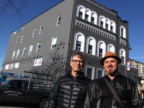 Jim Pumple and Patrick Coutu stand in front of 117 Christina St. N. which they're renovating into a short-term rental property. Longer-term rentals and a restaurant are queued to open on the lower two floors. (Tyler Kula/Sarnia Observer)