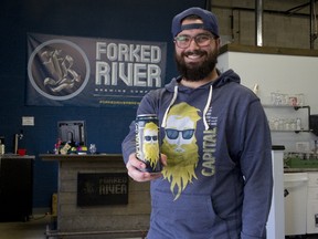 Forked River Brewing Company tap room manager Nate Torresan sports an image of Edward Thatch, the face of Capital Blonde Ale. (DEREK RUTTAN, The London Free Press)