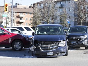 One person was taken to hospital with injuries not considered life threatening after three vehicles collided in the intersection of Springbank Drive and Wonderland Road Tuesday, a collision police say was caused by a 13-year-old in a stolen minivan. (DEREK RUTTAN, The London Free Press)