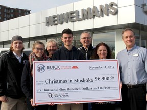 Christmas in Muskoka is off to a flying start for another year thanks to the support of local businesses such as Heuvelmans GMC dealership, which provided a $6,900 donation through its Buick Canada Drive for Your Students test drive program. Ursuline College Chatham students, from front left, Zach Van Boxtel, Alexis Van Boxtel and Conner Quinton, accepted a cheque from Beth Washburn, customer retention, and Scott Heuvelmans, dealer principal. In the back are Christmas in Muskoka co-chairs Gerri Brown and Shawn Moynihan.