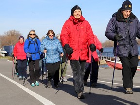 Ian MacAlpine/The Whig-Standard
Members of Kari Galasso’s Nordic walking club from the Seniors Association of Kingston walk near the Woolen Mill on Tuesday as part of their virtual walk across Canada.