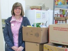 Library supervisor Leah Ede-Pisano drops off food donations collected from the Food for Fines program at the Aylmer branch to the Corner Cupboard in Aylmer in 2016. (Contributed photo)