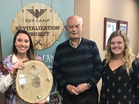 To kick off the campaign, senior staff members DÕArcy Munn (not shown), Katie Peruniak, left, Emma Langlois, right and RKY Board Chair David Crane (not shown), presented a very special recognition plaque to honour the campÕs biggest benefactor, Brit Smith, centre, and Homestead Land Holdings. Supplied by RKY Camp Board Team