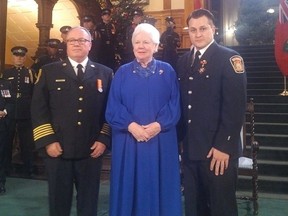 Sarnia firefighter Jim Rose, right, recently received the Ontario Medal for Firefighter Bravery for helping rescue a boater and dog in peril in 2016. With Rose at Queen's Park Tuesday in Toronto are Sarnia Fire Chief John Kingyens and Ontario Lt.-Gov. Elizabeth Dowdeswell. (Photo courtesy Sarnia-Lambton MPP Bob Bailey)