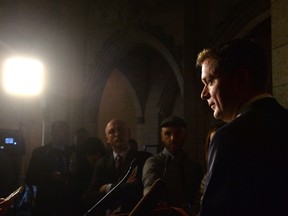 Conservative leader Andrew Scheer speaks with the media in the Foyer of the House of Commons Wednesday, Nov. 29, 2017. Scheer is calling for embattled Finance Minister Bill Morneau to resign. THE CANADIAN PRESS/Adrian Wyld