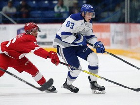 Morgan Frost of the Soo Greyhounds battles for the puck with Zack Malik of the Sudbury Wolves during OHL action from the Sudbury Community Arena in Sudbury, Ont. on Wednesday October 18, 2017. Gino Donato/Sudbury Star/Postmedia Network