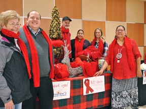 Elizabeth Cannon from United Way Chatham-Kent, AIDS Support Chatham-Kent community development coordinator Steve Pratt, Scott Roose, Stacie Harding from AIDS Support, nursing student Melissa Vujanovic and Lana Parenteau, outreach and support in the southwest region for Ontario Aboriginal HIV/AIDS Strategy, are shown at an information booth for AIDS Awareness Week at the Downtown Chatham Centre.