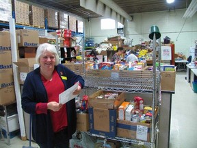 Jacks Evans/Special to The Intelligencer
Susanne Quinlan is not a “foodie” by modern definition, but she is surrounded by mounds of food items of all types regularly distributed to thousands of people by the Gleaners Food Bank.