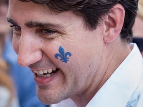 Justin Trudeau Prime Minister Justin Trudeau sports a Fleur de Lis on his cheek at a street party for the Fete National du Quebec on June 24, 2017 in Montreal. (Paul Chiasson/THE CANADIAN PRESS)
