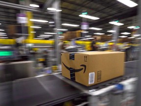Product moves along the conveyor inside the Amazon Fulfillment Centre in Brampton, Ont. on July 21, 2017. (Dave Abel/Toronto Sun/Postmedia Network)
