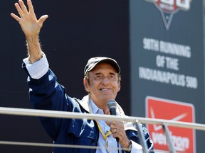 In this May 25, 2014 file photo, Jim Nabors waves to fans after singing before the start of the 98th running of the Indianapolis 500 IndyCar auto race at the Indianapolis Motor Speedway in Indianapolis. Nabors died peacefully at his home in Honolulu on Thursday with his husband Stan Cadwallader at his side. He was 87. (AP Photo/Michael Conroy, File)