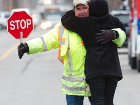 After 18 years, "Dave (Lane) The Crossing Guard" at Colborne Ave. at James St. hung up his stop sign on Friday, Dec. 18, 2015. (Free Press file photo)