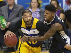 Malcolm Miller of the Saint John Riptide can't stop Royce White of the London Lightning from charging the basket during their game at Budweiser Gardens in London, Ont. on Friday, December 1, 2017. (DEREK RUTTAN, The London Free Press)