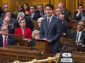 Prime Minister Justin Trudeau delivers a formal apology to individuals harmed by federal legislation, policies, and practices that led to the oppression of and discrimination against LGBTQ2 people in Canada, in the House of Commons in Ottawa on Nov. 28. Photo by The Canadian Press.