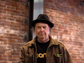 Canadian musician Neil Young leaves a news conference in Vancouver, B.C., on Monday, November 23, 2015. Neil Young is officially headed back to his hometown of Omemee, Ont., for an intimate concert on Friday night, but good luck scoring last-minute tickets. THE CANADIAN PRESS/Darryl Dyck ORG