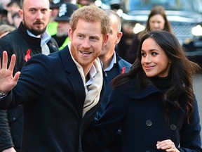Britain's Prince Harry and his fiancee US actress Meghan Markle greet wellwishers on a walkabout as they arrive for an engagement at Nottingham Contemporary in Nottingham, central England, on December 1, 2017. OLI SCARFF/AFP/Getty Images