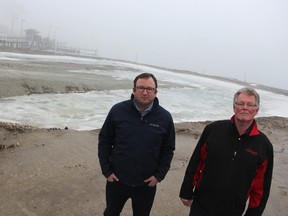 John Cowan, left, with Needham's Marine, and Ed Holubowicz, with Bluewater Anglers, stand at the under-construction Sarnia boat launch area, near Sarnia Bay Marina, in January, 2017. Sarnia's chief administrator says the plan is to have the new ramp built by spring, 2018. (Observer file photo)