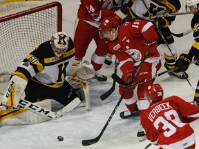 Soo Greyhounds' Mac Hollowell tries to tip the puck past Kingston Frontenacs goaltender Jeremy Helvig during OHL action at the Rogers K-Rock Centre in Kingston on Dec. 1, 2017. (JULIA MCKAY/The Whig-Standard/Postmedia Network)