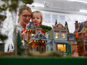 Tim MIller/The Intelligencer
Stephanie Shackleton of Belleville and her young daughter Avi check out one of the many displays at the Quinte 22nd Annual Model Railroad Show at Quinte Secondary School on Saturday.