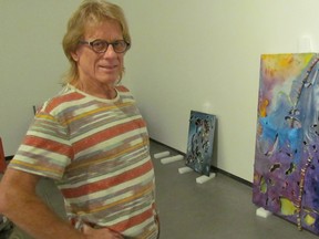 Sarnia artist Gary Nixon is shown in this file photo as his work was being installed in July 2016 for a pop up show at the Judith and Norman Alix Art Gallery in downtown Sarnia. The gallery has issued a call for local artists interested in similar pop up shows in 2018, through its Look and See program.
File photo/Sarnia Observer/Postmedia Network