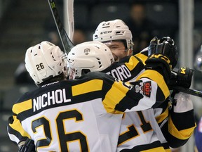 Kingston Frontenacs players celebrate Ryan Cranford’s goal at the end of the second period against the Barrie Colts during Ontario Hockey League action at the Rogers K-Rock Centre on Sunday. (Steph Crosier/The Whig-Standard)