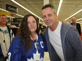 Kingston native and former Cornwall Royals star Doug Gilmour was in Cornwall on Saturday to sign his new book Killer: My Life in Hockey. Fan and former classmate Laurie McTaggart, left, got Gilmour to autograph a number of things for her. (Lois Ann Baker/Postmedia Network)