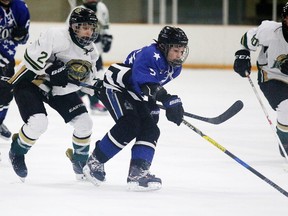 Carson Lloyd of the Gloucester Rangers battles for the puck with Mederic Bourdon of the Nickel City Jr. Sons during major bantam AA semi-final action at the Sudbury Regional Silverstick Tournament in Sudbury, Ont. on Sunday December 3, 2017. Gino Donato/Sudbury Star/Postmedia Network