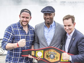 From left: Madoc boxer Dillon (Big Country) Carman shows off his Canadian heavyweight boxing championship belt along with former world champion Lennox Lewis and promoter Les Woods at Niagara Falls prior to his weekend title defence. (Bob Tymczyszyn/Postmedia Network)