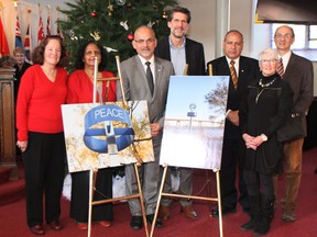 Submitted photo
Members of several different faith groups took part in a blessing of Belleville’s new peace pole. They include (from left) Margaret Finney, Dr. Aruna Alexander, Belleville mayor Taso Christopher, Scott Roodvoets, Jerry Selah, Shawn Doyle and Steve Hayman.