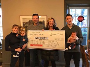 Revitalization Committee members Adam Moore and Leah Noel (centre)
accept the donation from Brianna Latimer, general manager of the Park House with her daughter, Olivia (left) and Adam Marshall, general manager of Beach Street Station with his daughter, Sawyer (right). (Contributed photo)