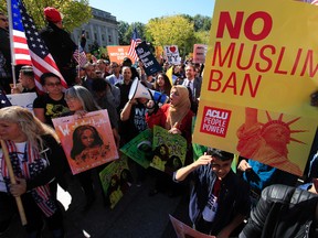 In this Oct. 18, 2017, file photo, protesters gather at a rally in Washington. (AP Photo/Manuel Balce Ceneta, File)