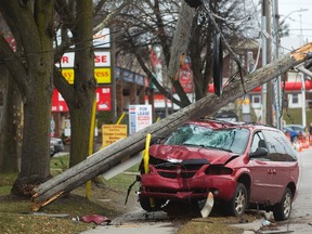 A van struck a utility pole on Oxford Street Tuesday afternoon. (MIKE HENSEN, The London Free Press)