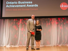 Angie Robson, manager of corporate and aboriginal affairs for Vale’s Ontario Operations, receives the OBAA Corporate Citizen Award from the award sponsor representative, Wade Stayzer, vice-president of retail for Meridian Credit Union. (Photo supplied)