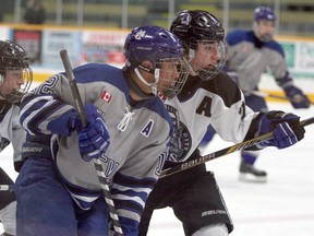 Sudbury Wolves' Mathieu Dokis-Dupuis (12) battles for position with Nickel City Sons's Tommy Vlahos players during NOHL bantam AAA final action at T.M. Davies Community Centre in Lively in March 2015. Ben Leeson/The Sudbury Star/ QMI Agency