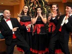 Performers of A Really Retro Crooner Christmas — Rick Kish (left), Maya Lacey, Nicola Klein, Jesslyn Hodgson, and Connor Boa — pose in front of a Christmas Tree during an intermission at Richmond Woods. Their annual show opens for a week on the McManus Stage Dec. 7. (Chris Montanini\Londoner\Postmedia Network)