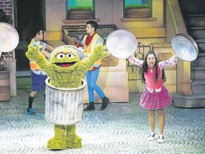 Singing and dancing with Oscar the Grouch. (Photo courtesy Feld Entertainment)