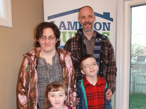 The Robinson family celebrate in their new home following a key ceremony organized by Habitat for Humanity Sarnia-Lambton on Nov. 28. Celebrating are mother Jocelyn, father Bruce, five-year-old Lilly and 10-year-old Erik.
CARL HNATYSHYN/SARNIA THIS WEEK