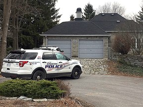 Two Kingston Police vehicles are parked in the driveway of 630 Graceland Ave. on Wednesday December 6 2017 after an murder-suicide took place on Tuesday. Ian MacAlpine /The Whig-Standard/Postmedia Network