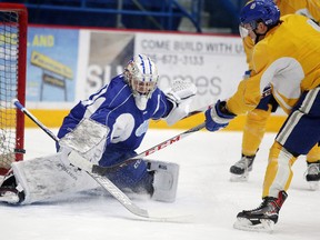 Sudbury Wolves goalie Jake McGrath makes a save on Darian Pilon during practice at Sudbury Community Arena on Wednesday, December 6, 2017. The Wolves visit the Peterborough Petes on Thursday at 7 p.m. Gino Donato/The Sudbury Star/Postmedia Network