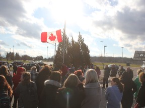 A crowd of men and women gathered outside Fanshawe College in St. Thomas Wednesday to honour the memories of women who lost their lives to violence on National Day of Remembrance and Action on Violence Against Women. (Laura Broadley/Times-Journal)