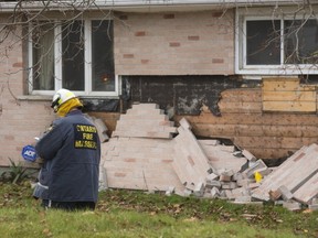 Clive Hubbard, a fire investigator for the Ontario Fire Marshal investigates an explosion and house fire at 1335 Hamilton Road in London, Ont. on Tuesday, Dec. 5, 2017. (MIKE HENSEN, The London Free Press)
