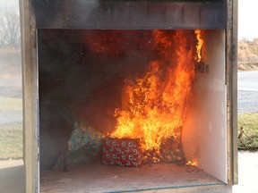 A Christmas tree is ablaze during a demonstration on how fast a dried out real Christmas tree can burn at the Kingston Fire & Rescue Training facility on Terry Fox Drive on Thursday December 7 2017. Ian MacAlpine /The Whig-Standard/Postmedia Network