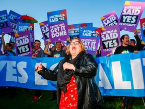 Magda Szubanski dances in front of equality ambassadors and volunteers from the Equality Campaign gathering in front of Parliament House in Canberra on December 7, 2017. SEAN DAVEY/AFP/Getty Images