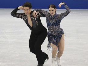 Tessa Virtue of London and Scott Moir of Ilderton compete the ice dance short dance at the Grand Prix of Figure Skating in Nagoya, Japan on Wednesday.  (TOSHIFUMI KITAMURA/Getty Images)