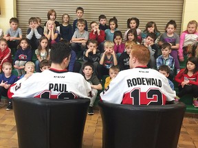 Belleville Senators forwards Nick Paul and Jack Rodewald read to elementary school children in Napanee this week as part of the AHL club's community initiative program. (Belleville Senators photo)
